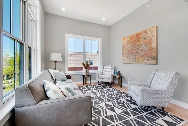 a living room with furniture and a rug