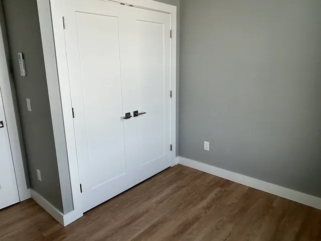 a view of a small space with wooden floor