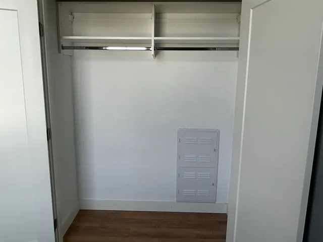 a view of an empty walk in closet