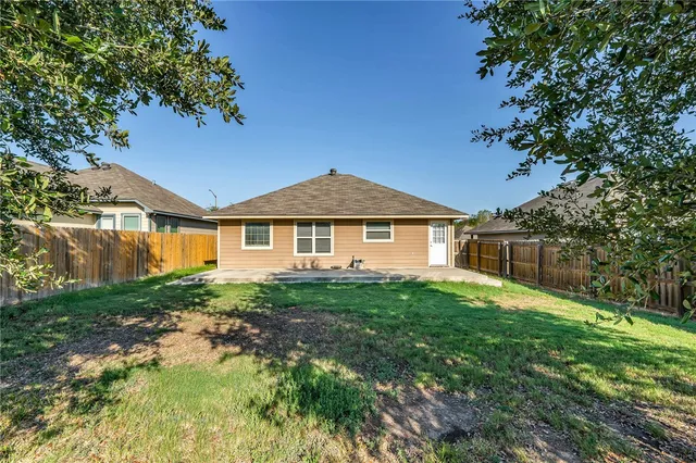 a front view of a house with yard