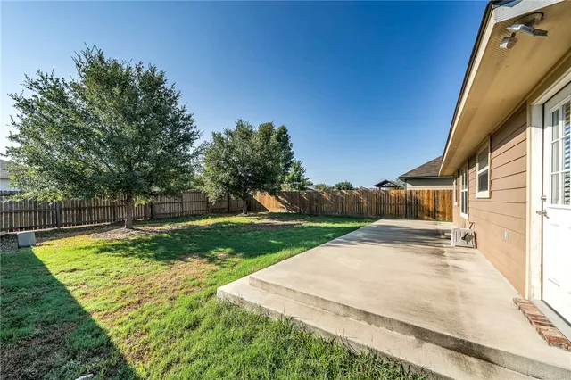 a view of a backyard with green space
