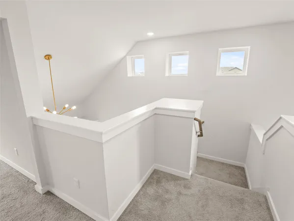 a view of entryway and kitchen