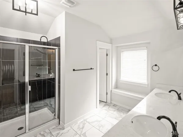 a bathroom with a tub and a shower