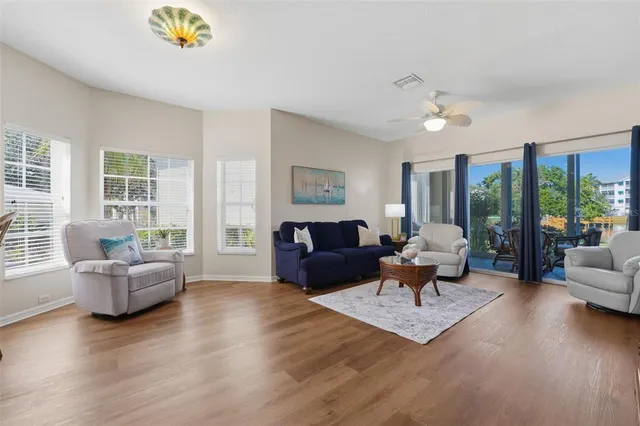 a living room with furniture and a large window