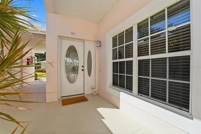 a front view of a house with a large window