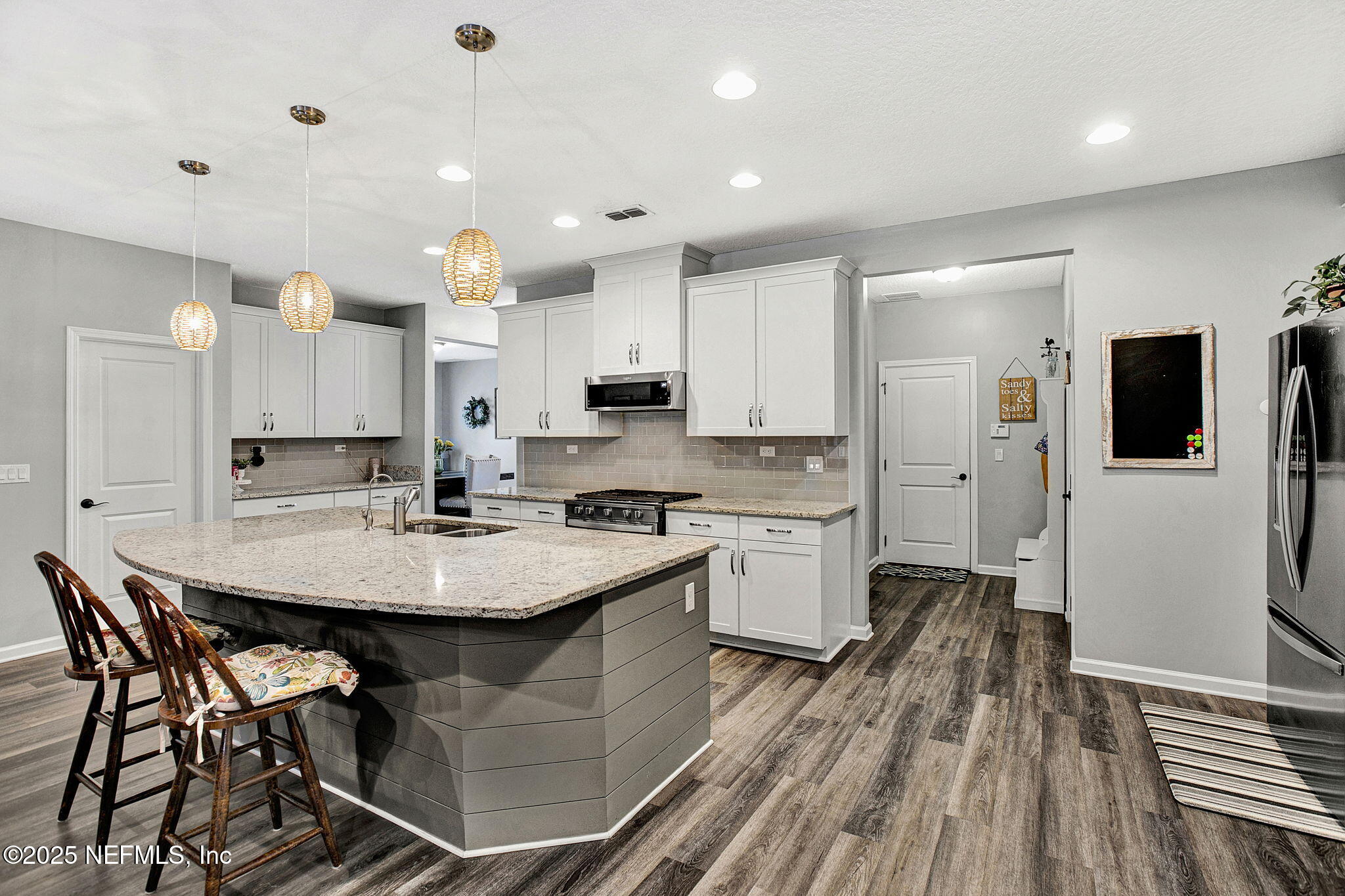 424 Willow Lake Drive St. Augustine, FL 32092 - Photo 13 of 52 a large kitchen with kitchen island a sink table and chairs