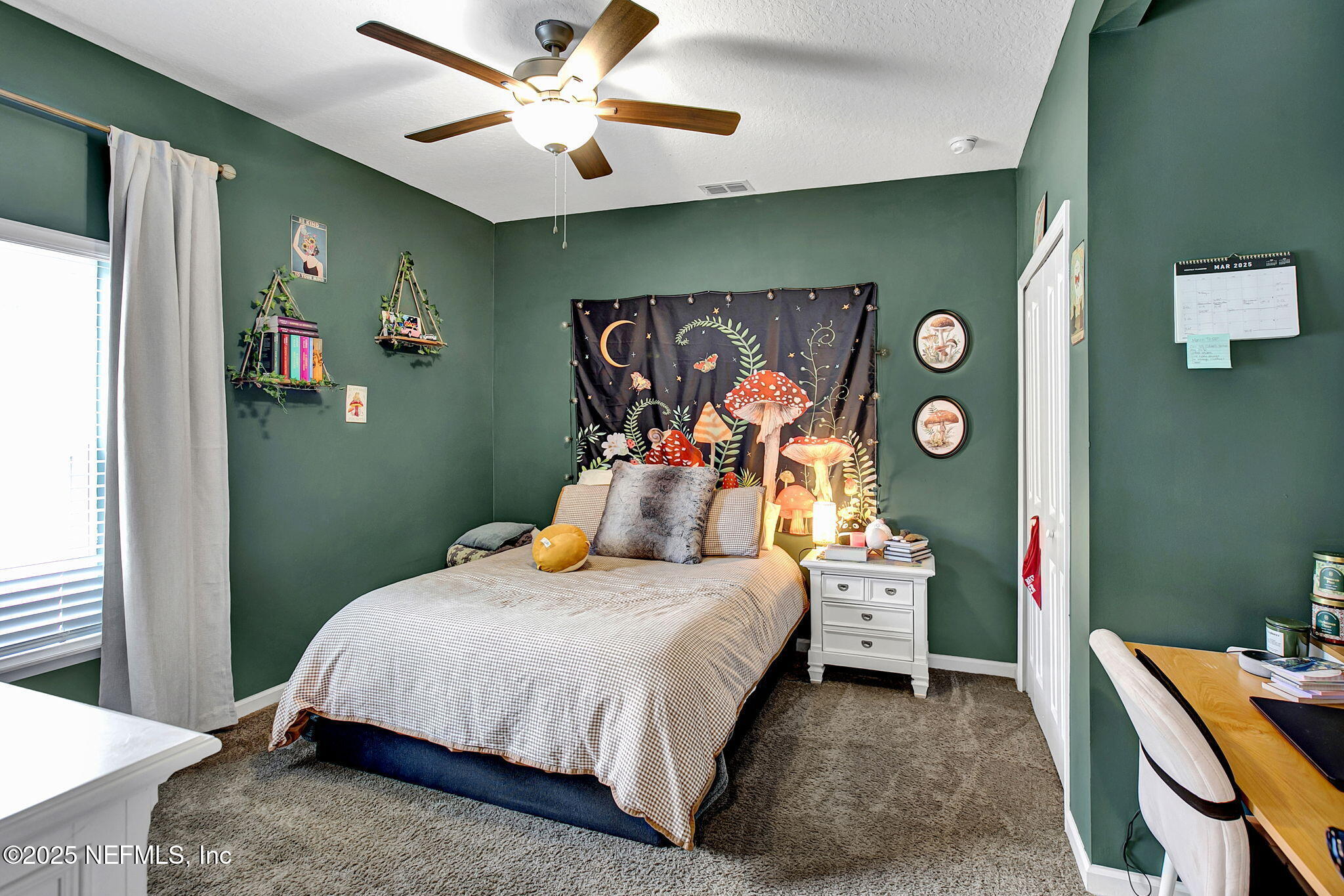 424 Willow Lake Drive St. Augustine, FL 32092 - Photo 24 of 52 a bedroom with a bed and a chandelier