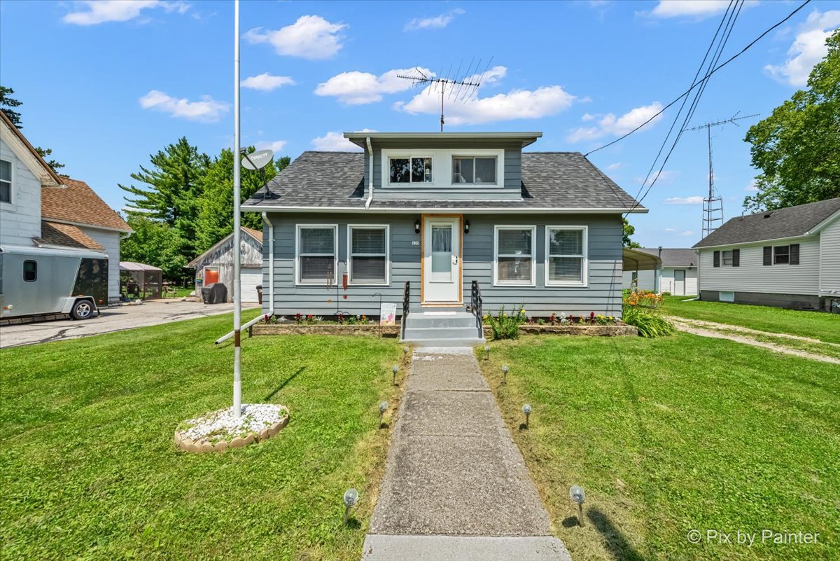 front view of a house with a yard