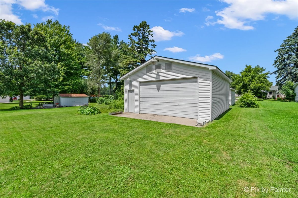 335 Ogden Street Capron, IL 61012 - Photo 5 of 18 a front view of a house with a yard
