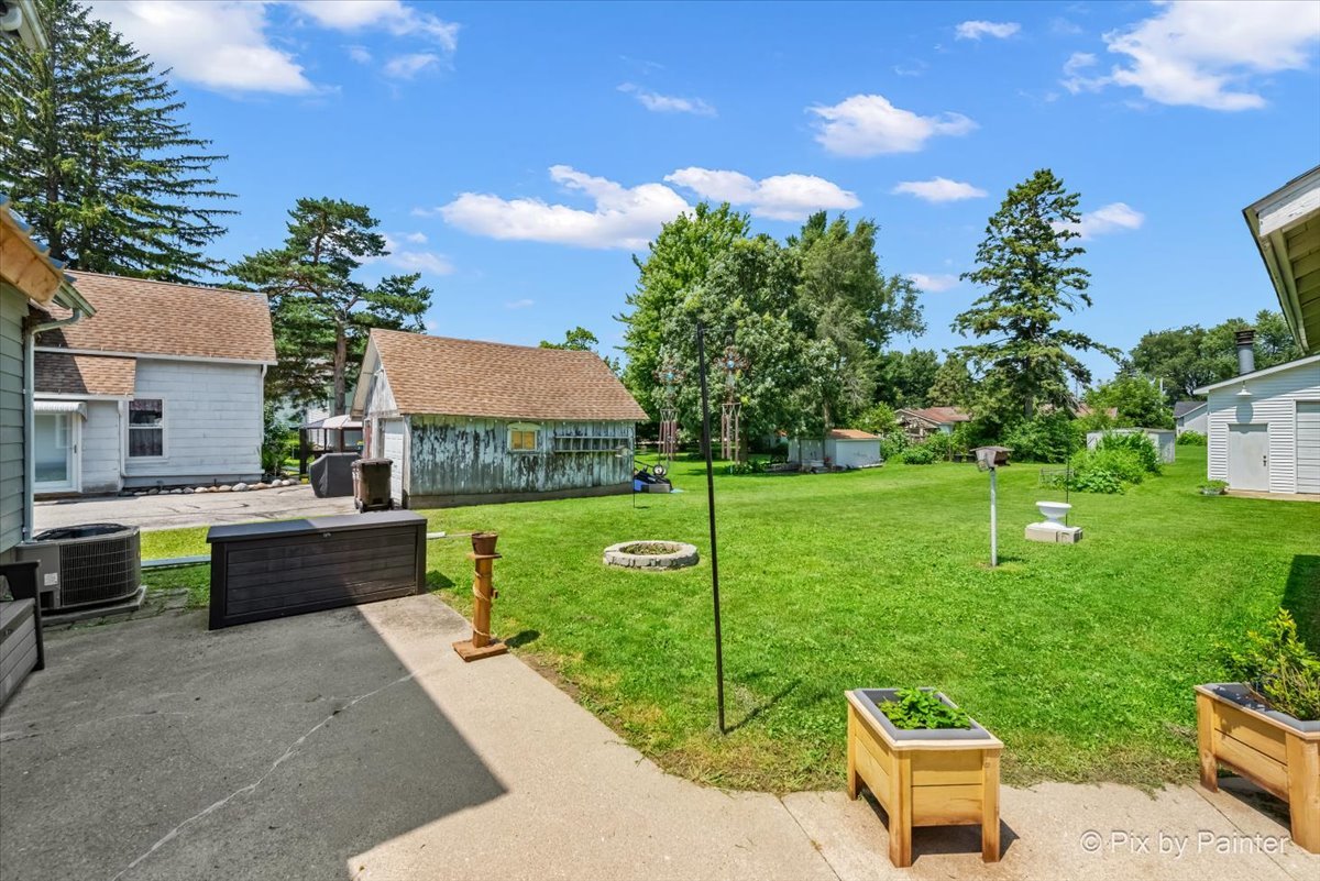 335 Ogden Street Capron, IL 61012 - Photo 8 of 18 a view of a garden with chairs