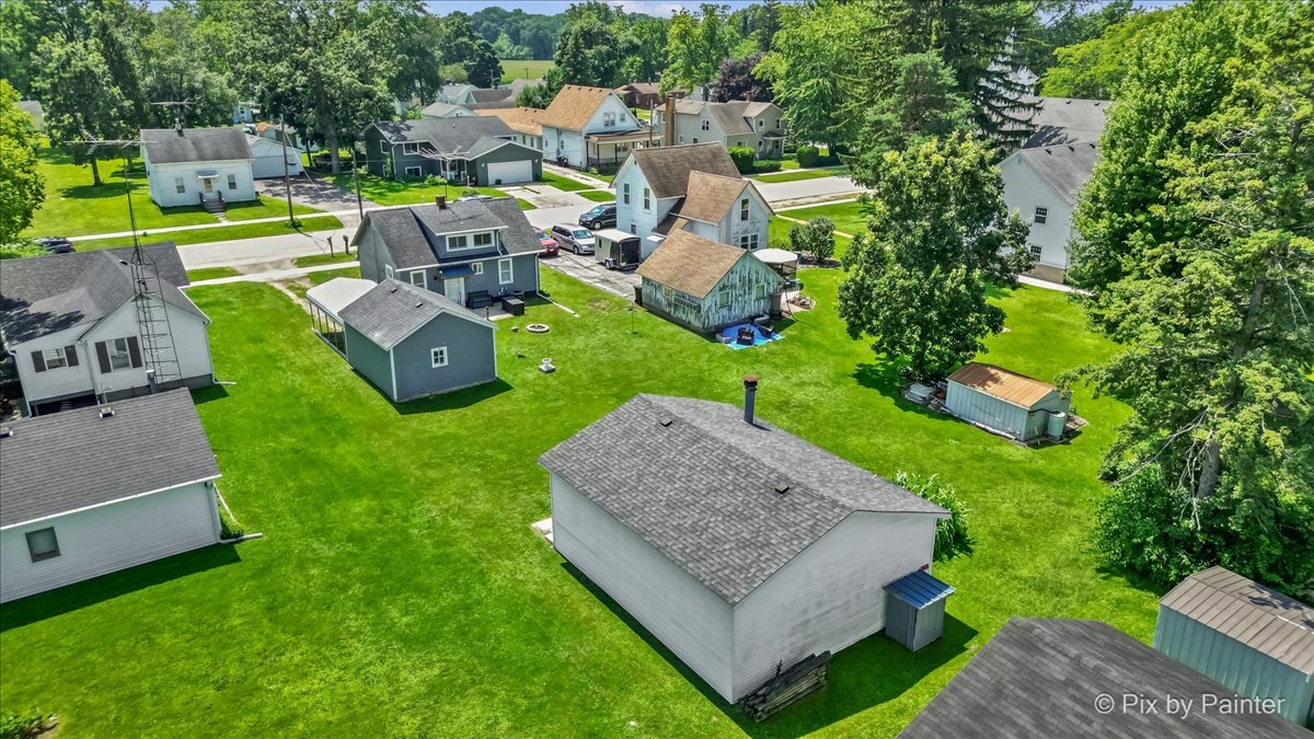 335 Ogden Street Capron, IL 61012 - Photo 9 of 18 an aerial view of a house with swimming pool garden and patio
