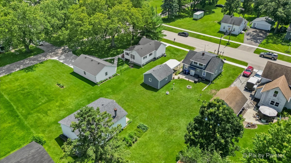335 Ogden Street Capron, IL 61012 - Photo 11 of 18 an aerial view of a house with yard swimming pool and outdoor seating