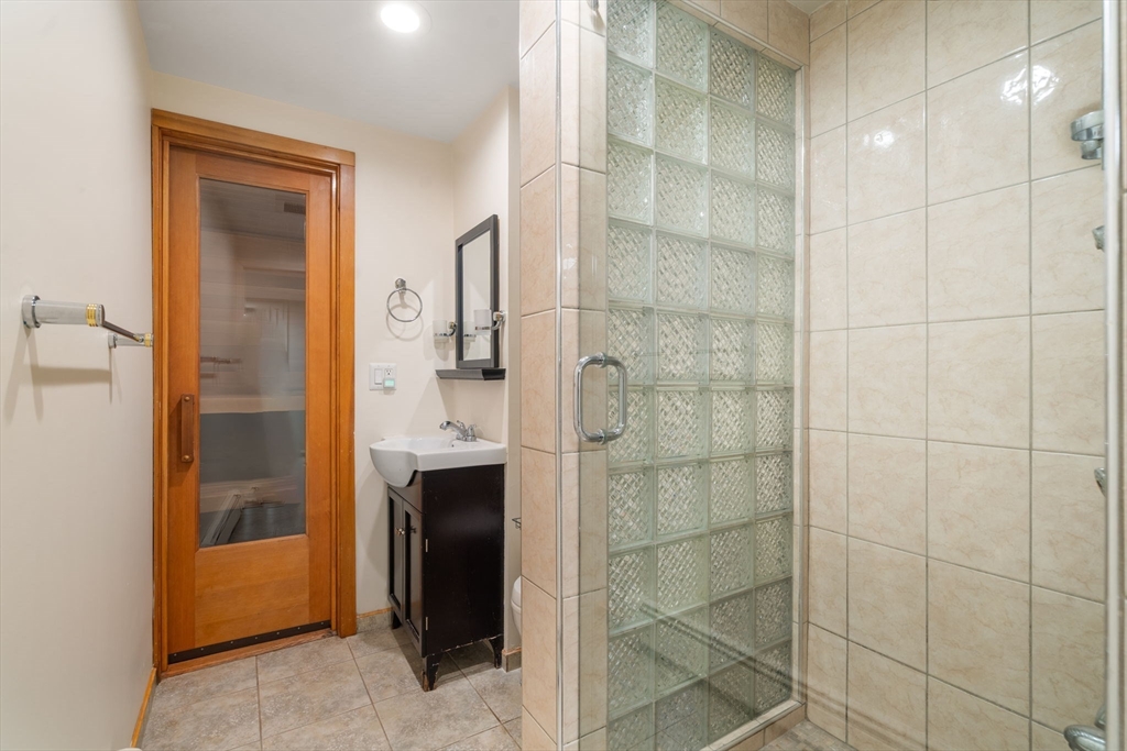 50 Mary Ellen Road Newton, MA 02468 - Photo 14 of 22 a bathroom with a shower and a sink