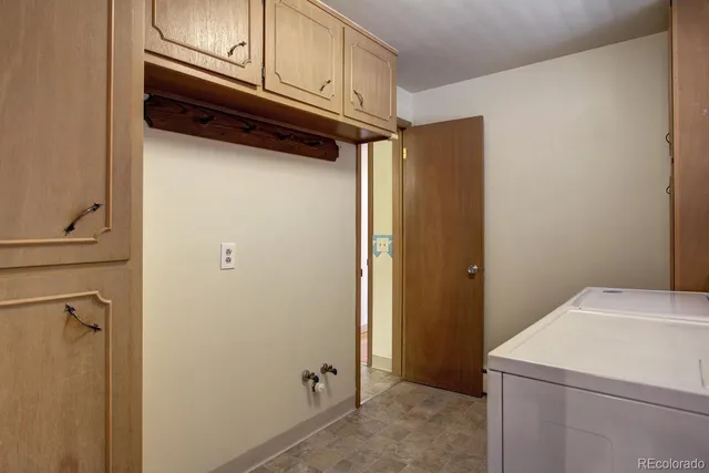 a spacious bathroom with a double vanity sink a mirror and a shower