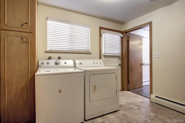 a view of a patio with table and chairs potted plants with wooden floor