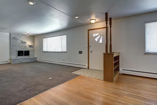 wooden floor in an empty room with a window