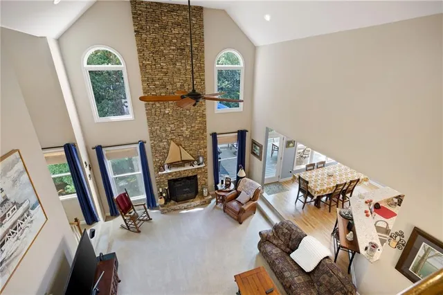 a spacious bedroom with bed and a large window