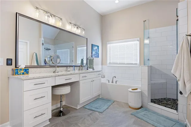 a bathroom with a bathtub and a shower