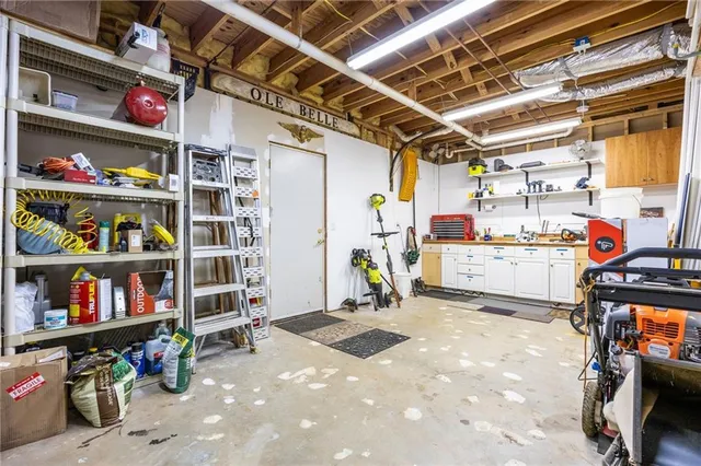 a backyard of a house with lots of green space and lake view