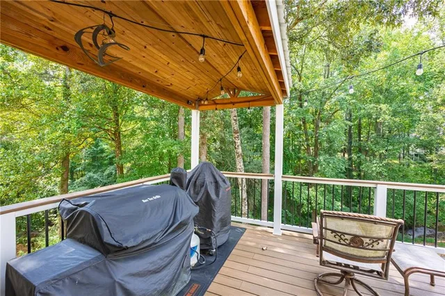 a view of a house with backyard and a tree