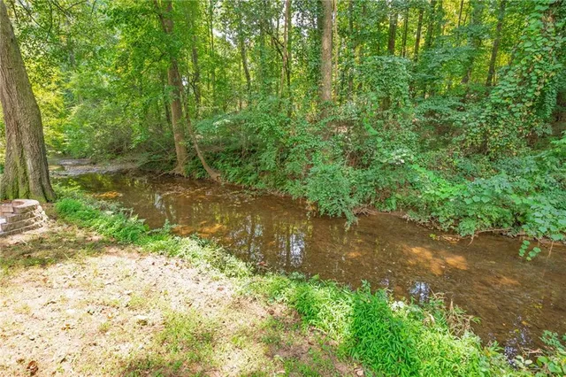 an aerial view of a house with lots of trees