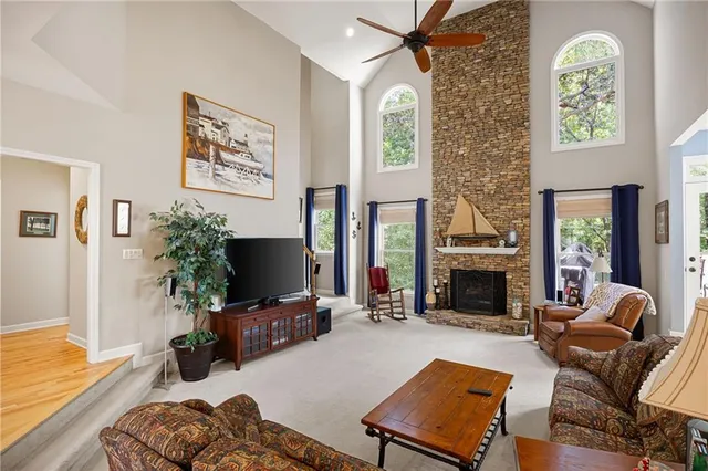 a living room with furniture fireplace and flat screen tv