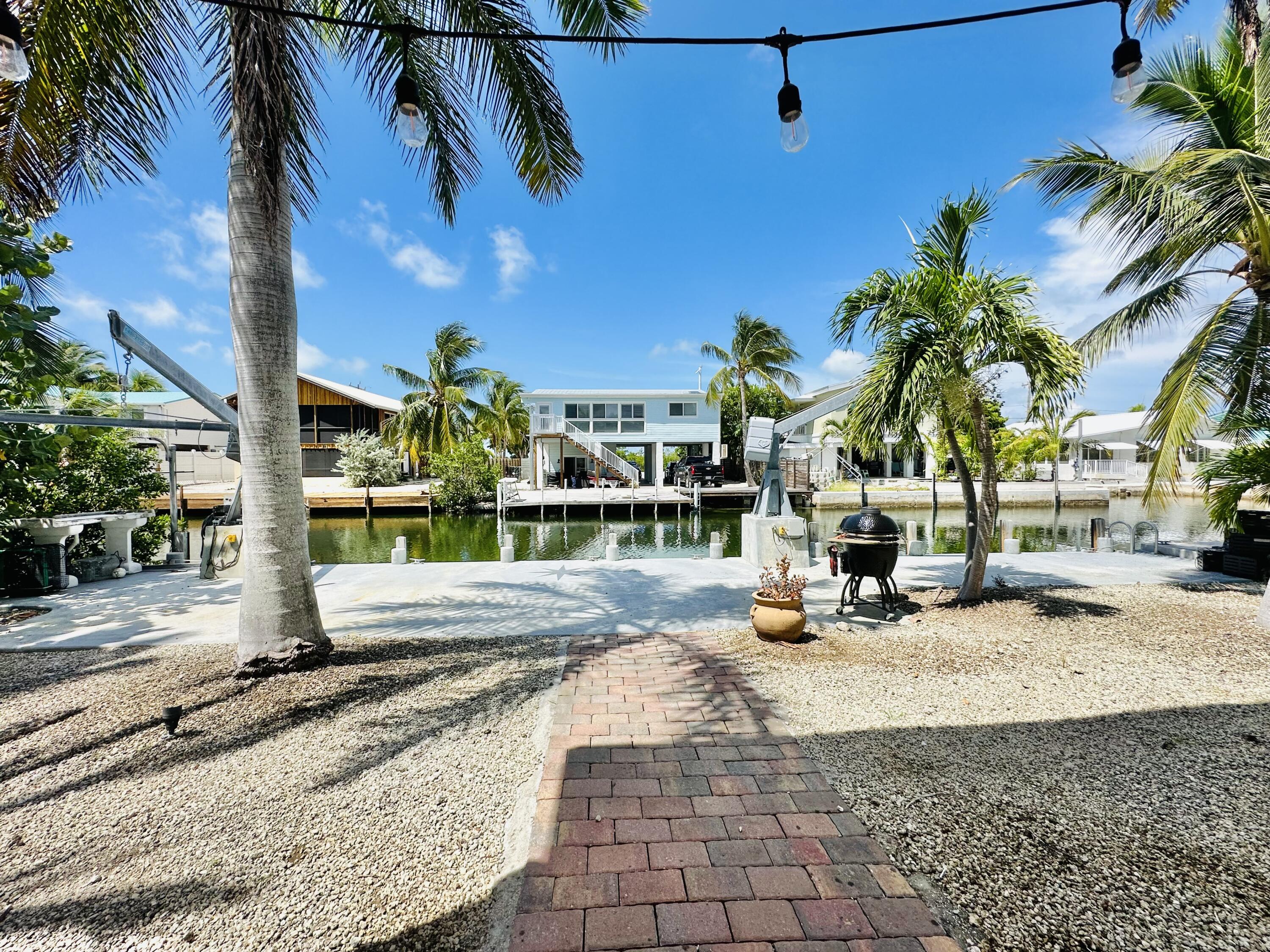 376 Blackbeard Road Summerland Key, FL 33042 - Photo 24 of 37 Concrete dock and paver back sidewalk