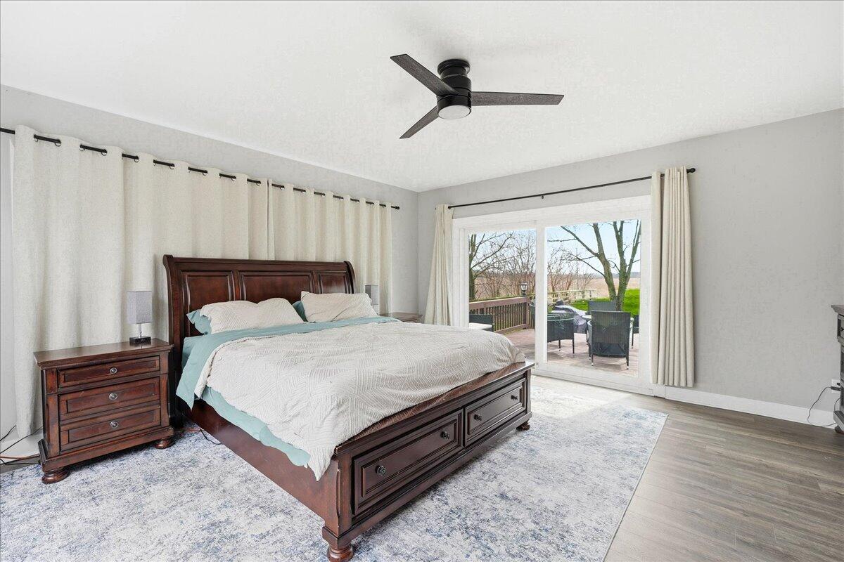 6411 East 129th Avenue Crown Point, IN 46307 - Photo 17 of 79 a bedroom with a bed and a large window