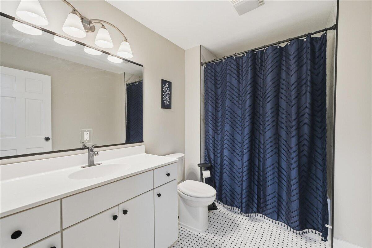 6411 East 129th Avenue Crown Point, IN 46307 - Photo 21 of 79 a bathroom with a sink a toilet and shower