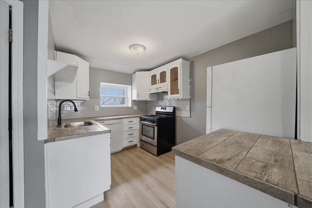 6411 East 129th Avenue Crown Point, IN 46307 - Photo 29 of 79 a kitchen with a sink stove and refrigerator