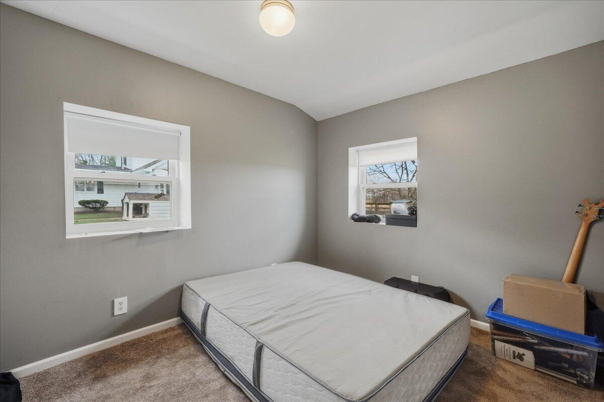 6411 East 129th Avenue Crown Point, IN 46307 - Photo 30 of 79 a bedroom with a bed and a desk
