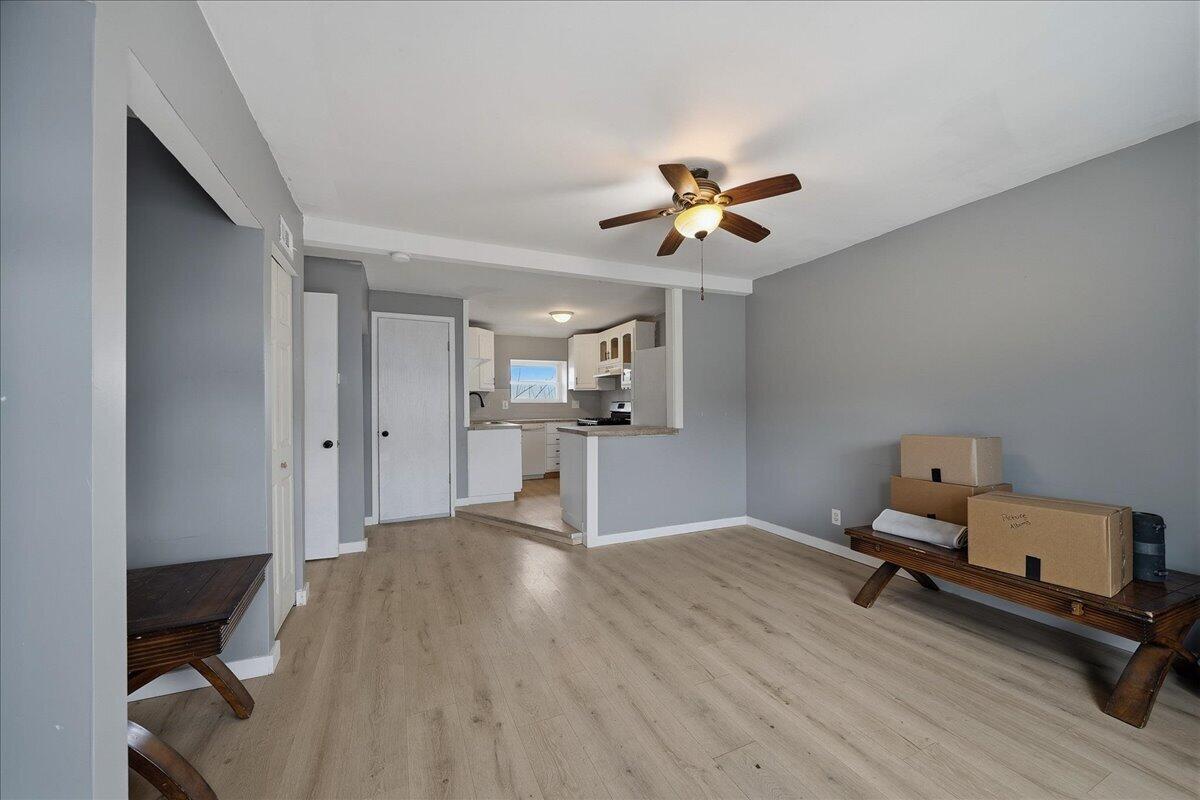 6411 East 129th Avenue Crown Point, IN 46307 - Photo 31 of 79 a view of a workspace with furniture and a ceiling fan