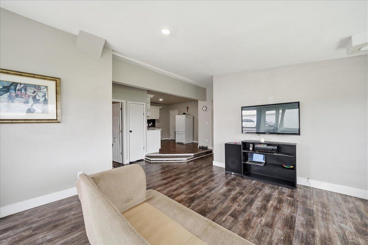 6411 East 129th Avenue Crown Point, IN 46307 - Photo 33 of 79 a living room with furniture and wooden floor