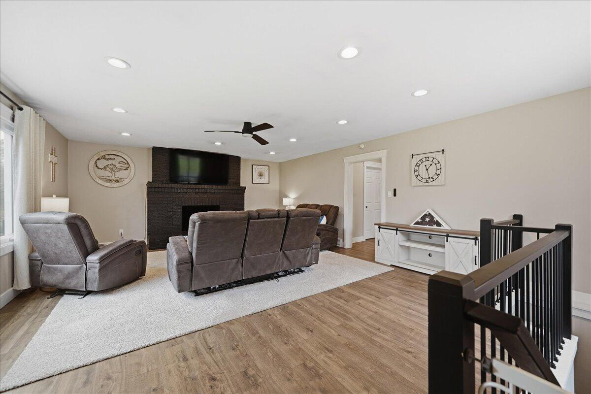6411 East 129th Avenue Crown Point, IN 46307 - Photo 39 of 79 a living room with furniture and a flat screen tv