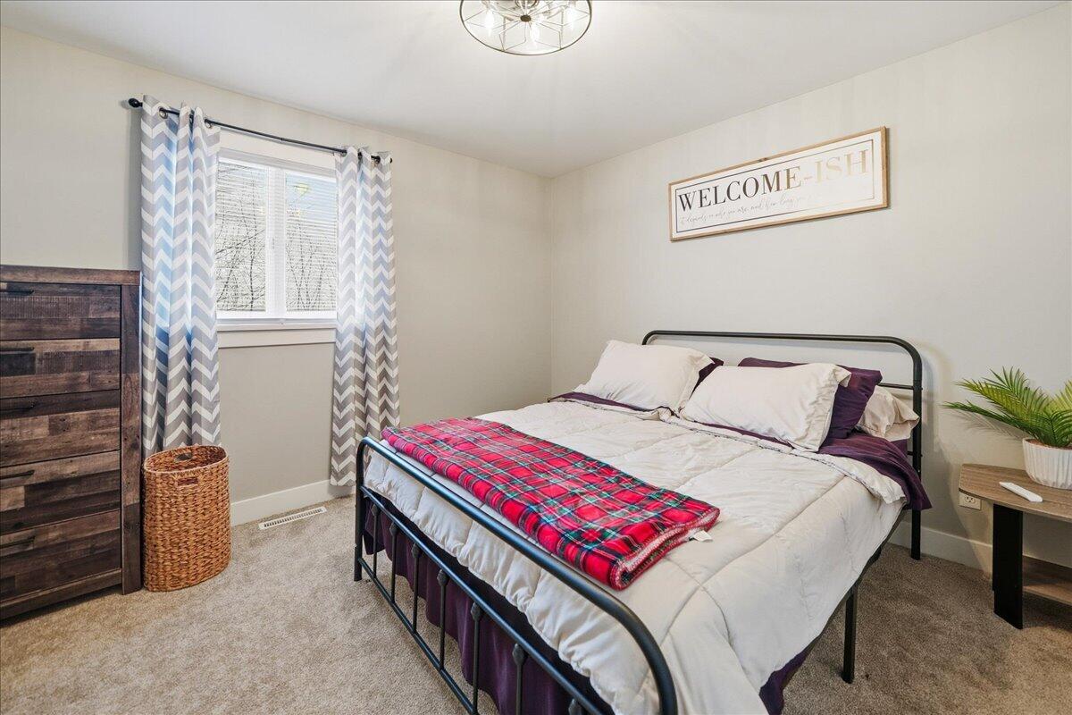 6411 East 129th Avenue Crown Point, IN 46307 - Photo 45 of 79 a bedroom with a bed and a window