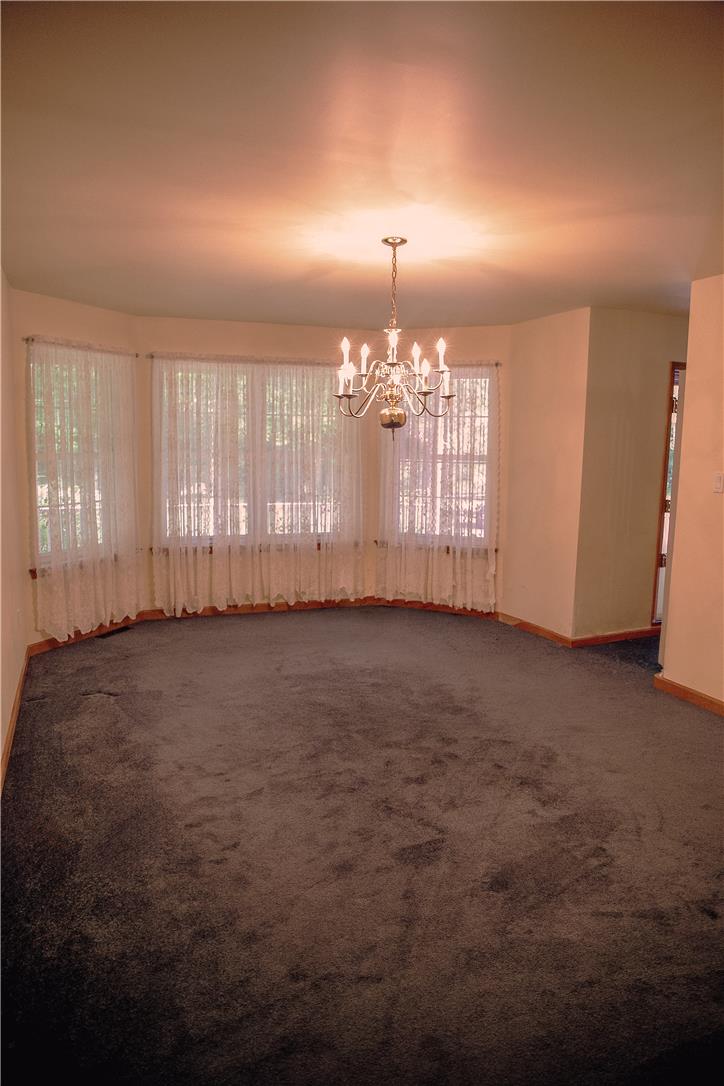 50 Anthony's Road White Haven, PA 18661 - Photo 22 of 57 A classic chandelier illuminates the generously sized room with comfortable carpeting.