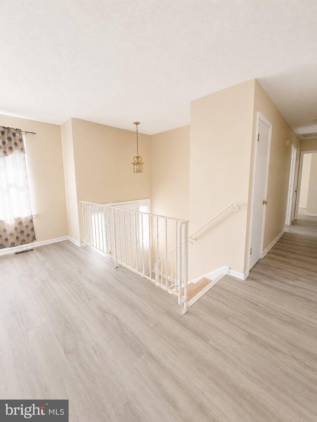 6204 Cipriano Road Lanham, MD 20706 - Photo 8 of 19 a view of a livingroom with wooden floor