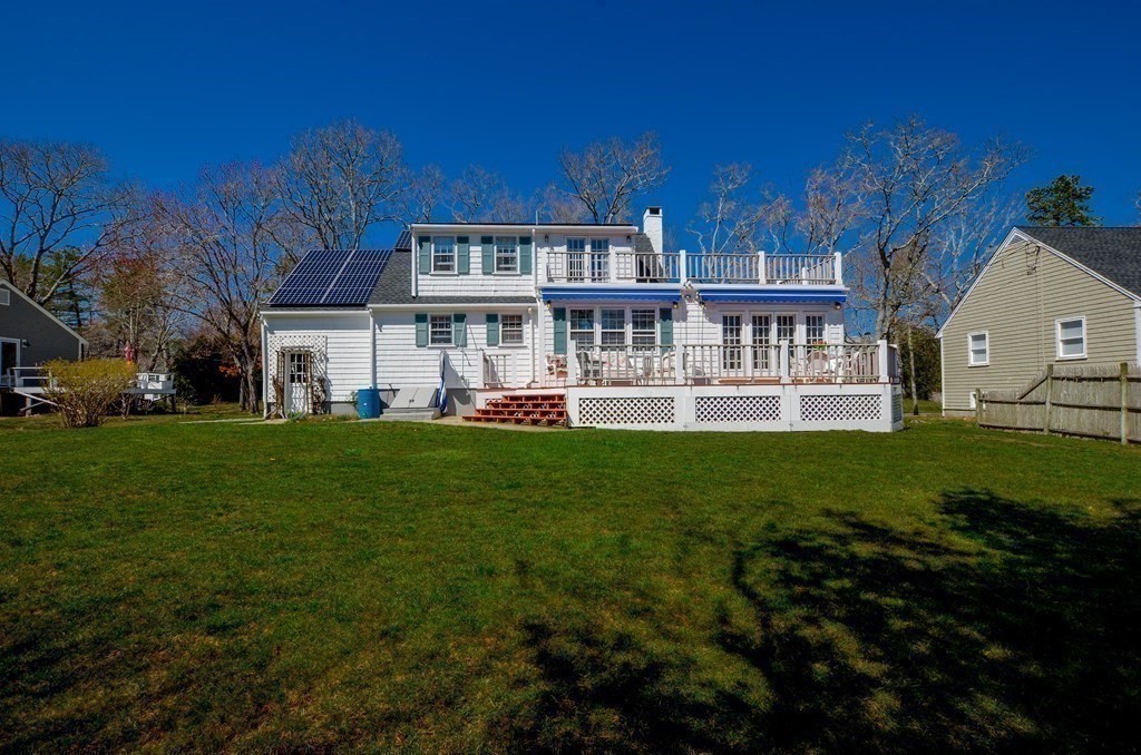 10 Zora Road Marion, MA 02738 - Photo 27 of 37 a front view of a house with a garden and trees