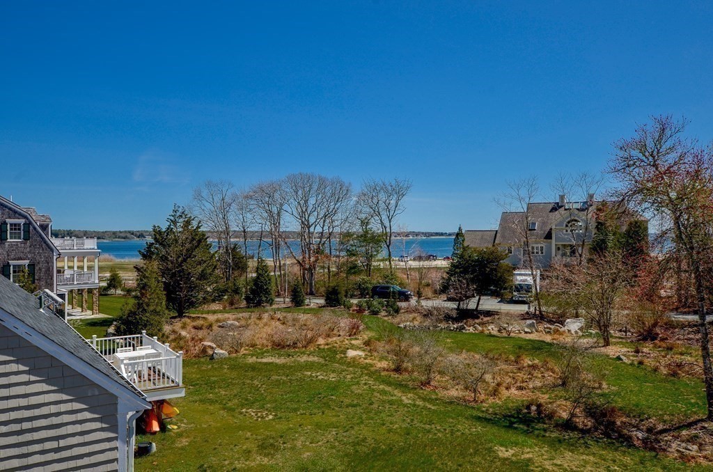 10 Zora Road Marion, MA 02738 - Photo 36 of 37 a view of a lake with couches and city view