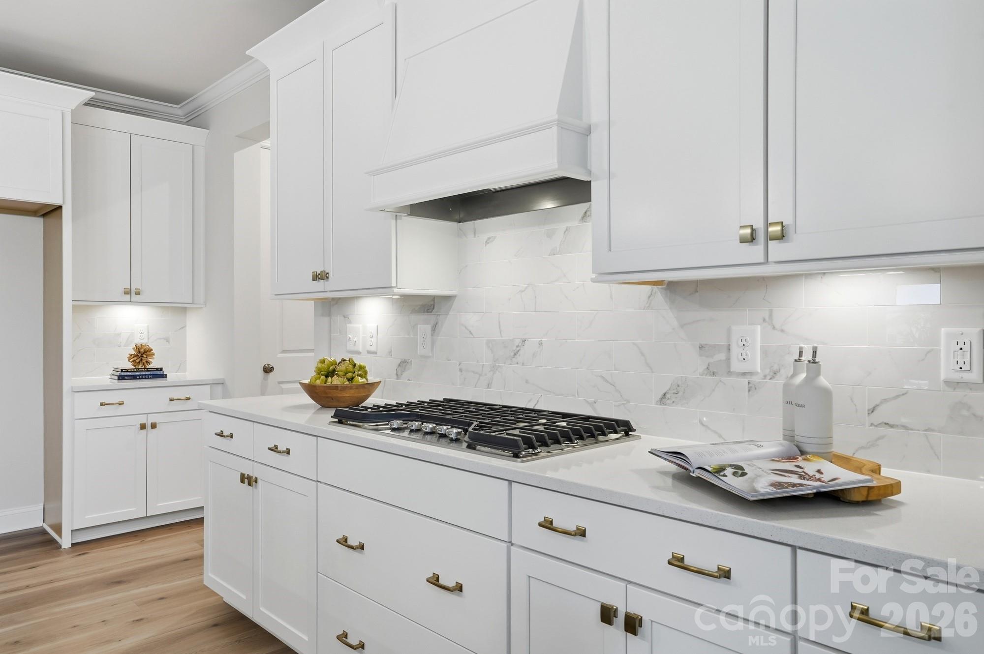 2549 Mabel Lane Monroe, NC 28110 - Photo 11 of 28 a kitchen with white cabinets and appliances