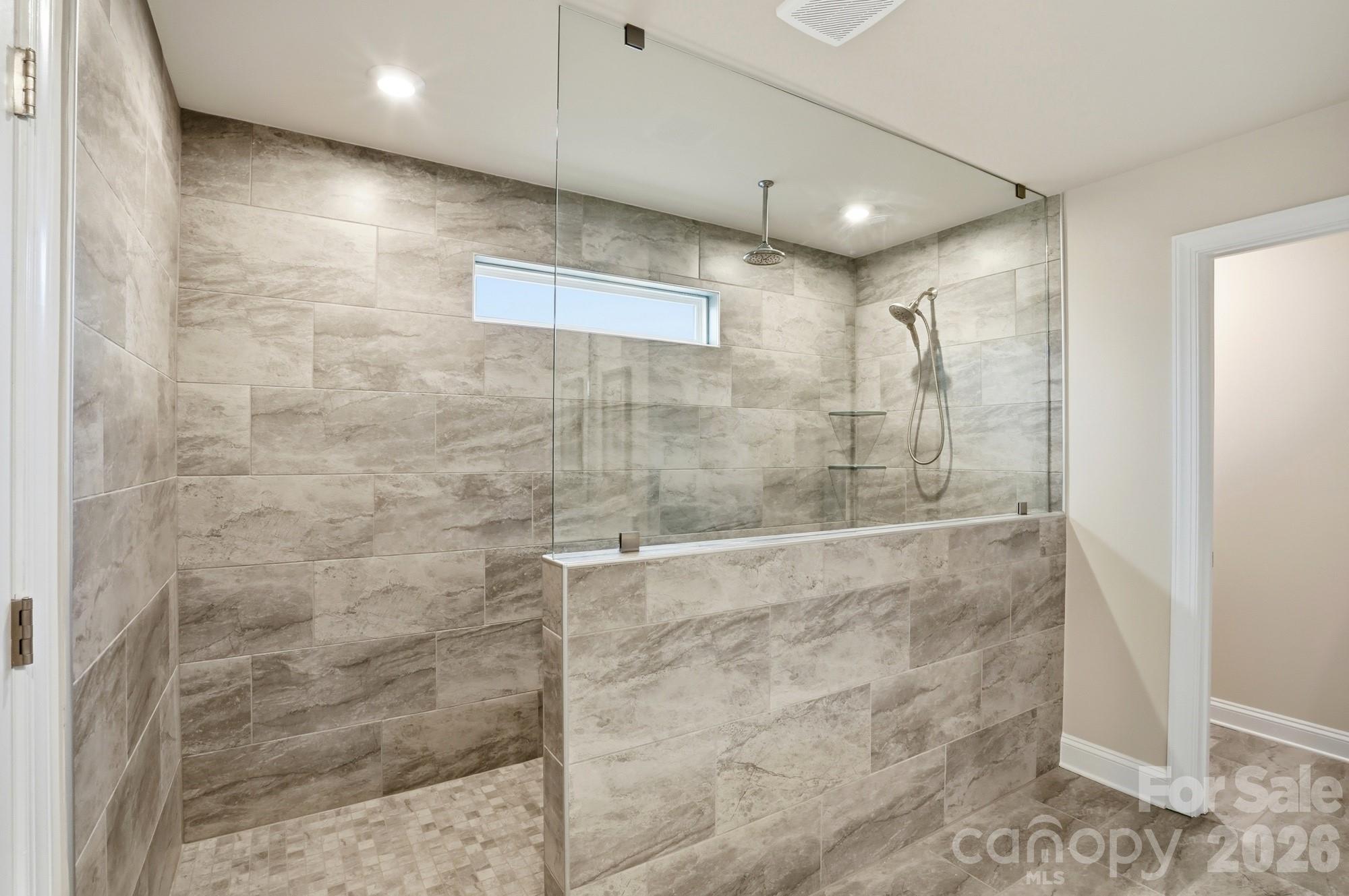 2549 Mabel Lane Monroe, NC 28110 - Photo 16 of 28 a bathroom with a shower