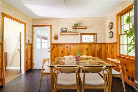 a kitchen that has a lot of cabinets in it