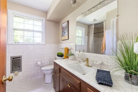 a view of an entryway with wooden floor and door