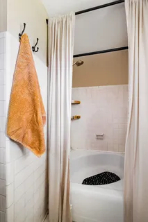 a view of a hallway with wooden walls