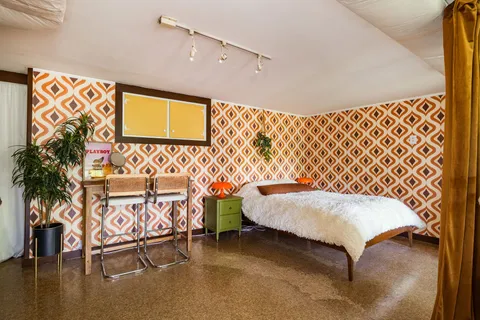 a swimming pool with outdoor seating and yard