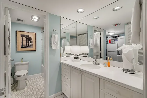 a bathroom with a shower and a toilet