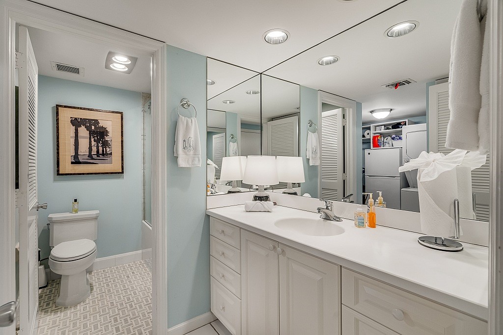 400 Beach Road, Unit 117 Vero Beach, FL 32963 - Photo 12 of 23 a bathroom with a sink a toilet and shower