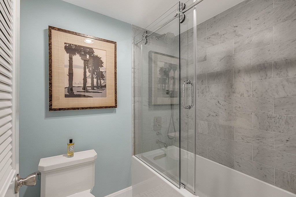 400 Beach Road, Unit 117 Vero Beach, FL 32963 - Photo 13 of 23 a bathroom with a shower and a toilet