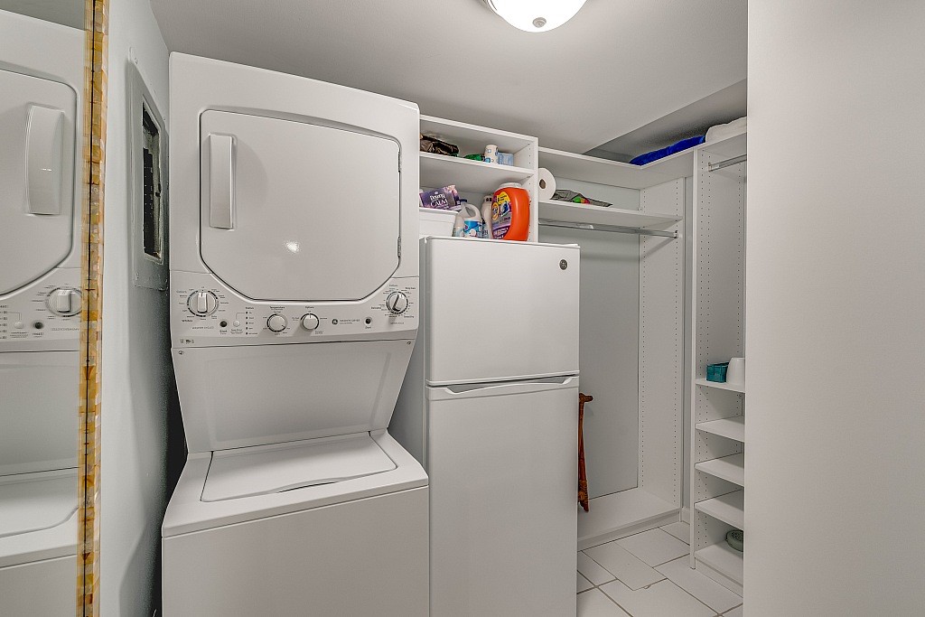 400 Beach Road, Unit 117 Vero Beach, FL 32963 - Photo 14 of 23 a utility room with dryer and washer