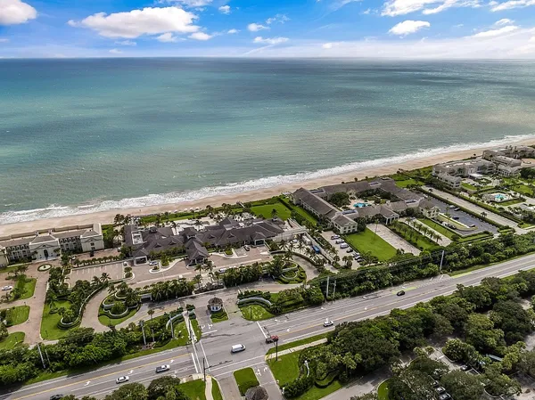 an aerial view of residential houses with outdoor space
